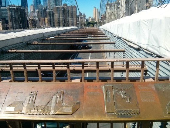 Cars riding the Brooklyn Bridge