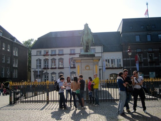Marktplatz, Jan-Wellem statue "the Count Palatine on the Rhine, the Lord High Steward and Elector of the Holy Roman Empire, the Duke of Bavaria, Jülich, Cleve, Berg, the highly meritorious Prince who has enlarged the city and founded the art gallery"