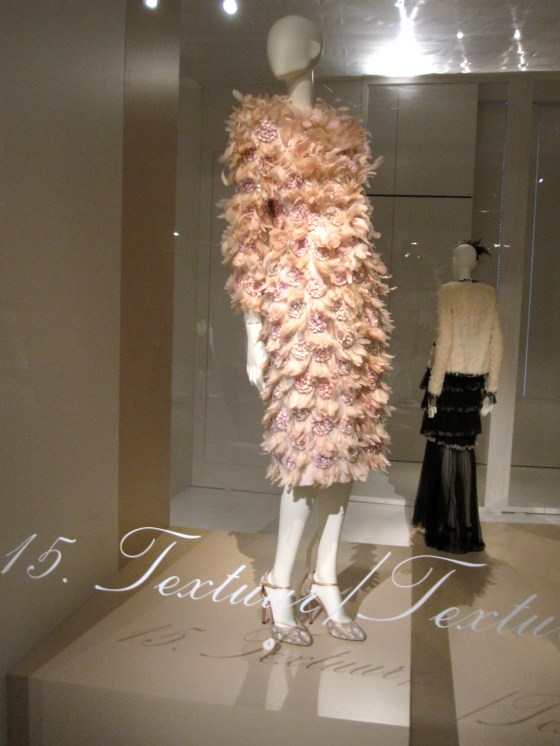 Giambatista Valli, Haute Couture Spring-Summer 2013; Cloak dress of silk crepe with applied grosgain flowers, embellished with rhinestones, glass beads, imitation feathers in organza and dyed chicken feathers