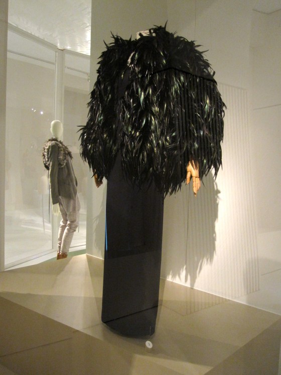 Yves Saint Laurent, Haute Couture Autumn-Winter 1996-1997; Evening ensemble of jacket with rooster feathers and dress in silk jersey