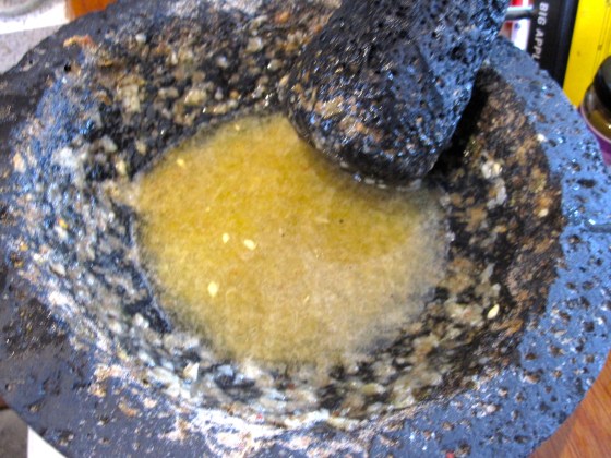 The pork marinade - mashed garlic, salt, and pepper with the naranja agria