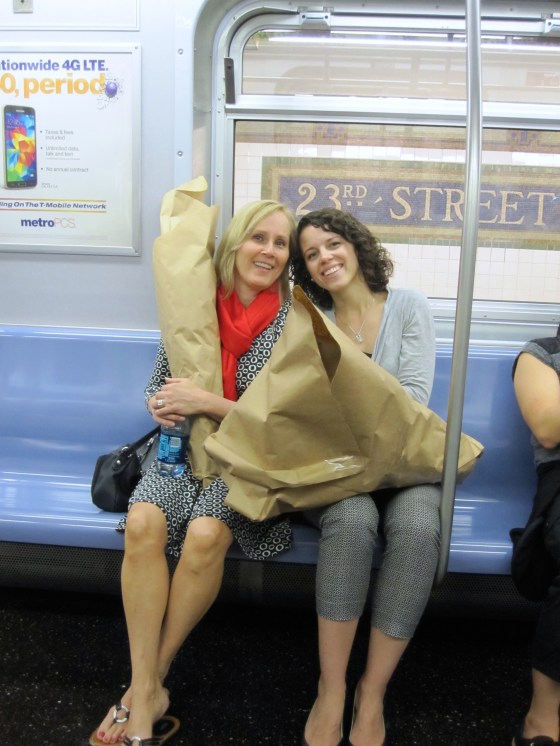 Annette and Ashley on the subway with the flowers