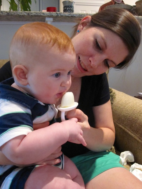 Edward trying his first milk popsicle