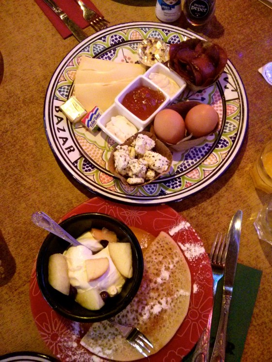 Pide, açma and simit, marinated feta cheese, seasoned cream cheese, kaymak (clotted cream), apricot jam, honey, thousand holes pancake, fresh fruit yoghurt, boiled egg, at Hotel Bazar