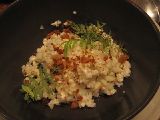 5: Cauliflower couscous cooked in chicken fat with sourdough crumble and marigold leaves topped with a slow poached egg