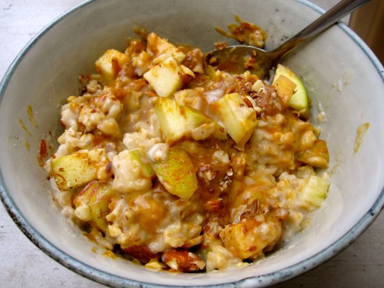 My oat grød with apples, almonds, and caramel sauce all mixed up