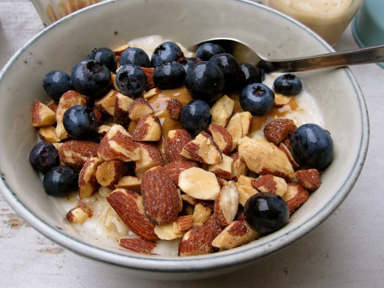 Closeup of my quinoa grød with blueberries, almonds, and caramel sauce