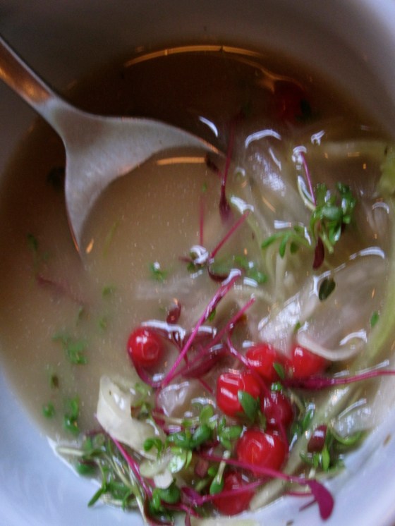 Seared duckhearts with white cabbage, cress, lindenberries, capers, and cep-mushrooms; stock from roasted yeast and mushrooms