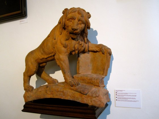 The Red Lion of Verdussen with a signboard, also a printer's mark, of one branch of the great Antwerp printing dynasty