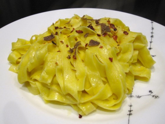 Fresh pasta with herb infused butter and cream, topped with chili flakes and fresh shaved truffle